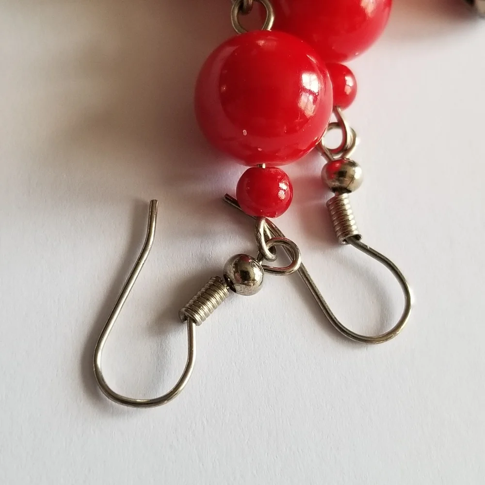 Feather earrings with red beads and flower ball beads silver tone boho